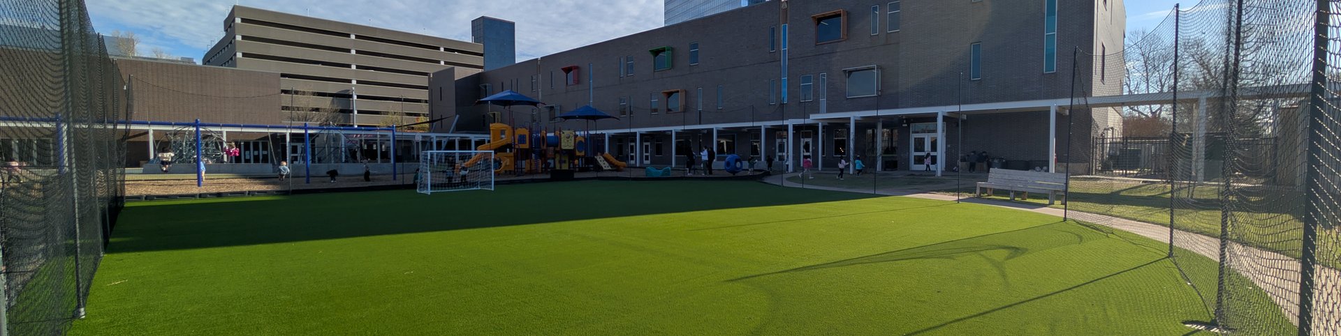 Artificial turf play field beside a school playground in downtown Oklahoma City