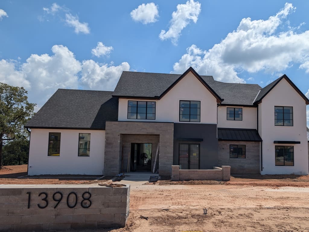 Before: bare dirt in front of a newly built modern home